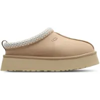 Ugg Kaufen Sie den Tazz II Sand bei Kicksshop. Bequemer beiger Slipper für Damen mit Plateausohle und weichem Wildleder.