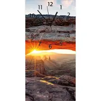 Wallario Design Wanduhr Sonnenstrahl am Horizont Leuchtende Felsspalte aus Echtglas, Größe 30 x 60 cm