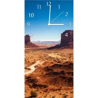 Wallario Design Wanduhr bedruckt, Größe 30 x 60 cm, Motiv: Monument Valley unter blauem Himmel