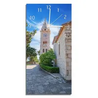 Wallario Design Wanduhr bedruckt, Größe 30 x 60 cm, Motiv: Stille am Kirchturm