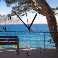Wallario Design Wanduhr Einsame Bank am Meer - Spanien im Sommer aus Echtglas, Größe 30 x 30 cm