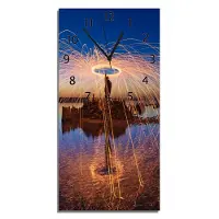 Wallario Design Wanduhr bedruckt, Größe 30 x 60 cm, Motiv: Feuerkreise am Wasser