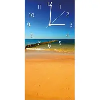 Wallario Design Wanduhr bedruckt, Größe 30 x 60 cm, Motiv: Sandstrand in orange - Blaues Meer - Blauer Himmel