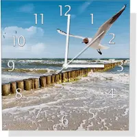 Wallario Design Wanduhr Fliegende Möwe am Strand aus Aluverbund, Größe 30 x 30 cm