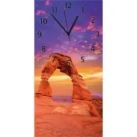 Wallario Design Wanduhr bedruckt, Größe 30 x 60 cm, Motiv: Steinbogen vor einem farbenfrohen Himmel in lila-rot