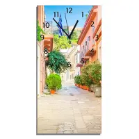Wallario Design Wanduhr bedruckt, Größe 30 x 60 cm, Motiv: Mediterrane Straße im Blütenrausch