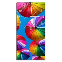Wallario Design Wanduhr Bunte Regenschirme vor blauem Himmel aus Echtglas, Größe 30 x 60 cm