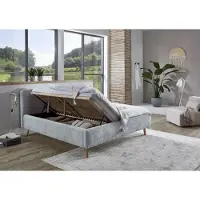 Meise Stauraumbett Mattis 180x200 cm | Doppelbett | Bettkasten & Lattenrost (Federholzrahmen) | Strukturstoff Hellblau | Holzfuß eichefarbig